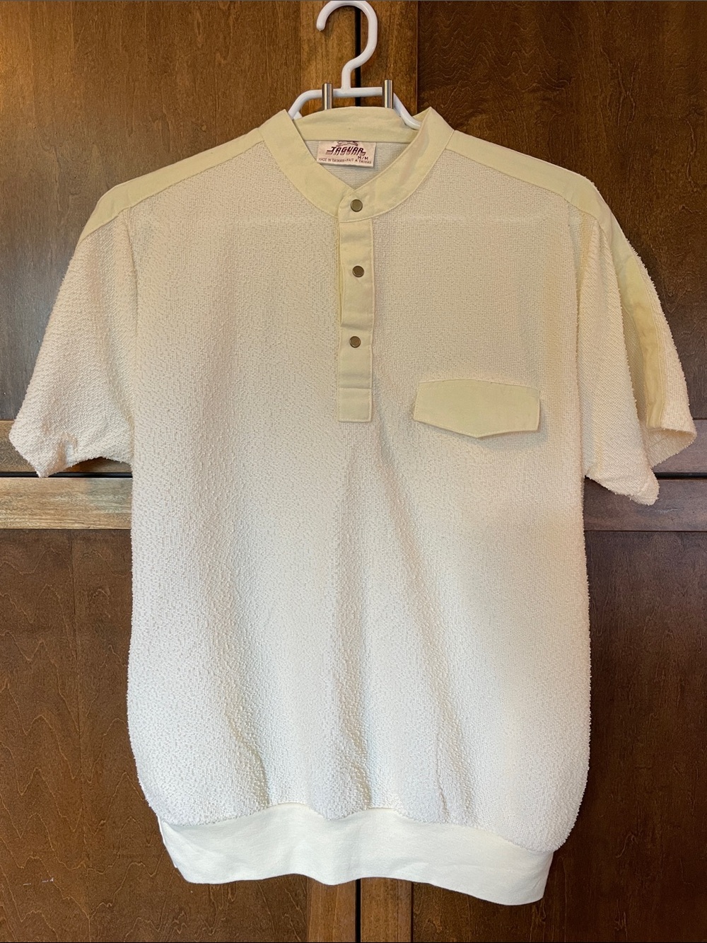 Jaguar textured yellow pullover short sleeve shirt.